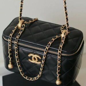 Chanel small black quilted lambskin chain cosmetic bag